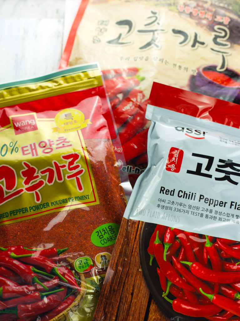Three brands of Korean red pepper flakes for comparison.