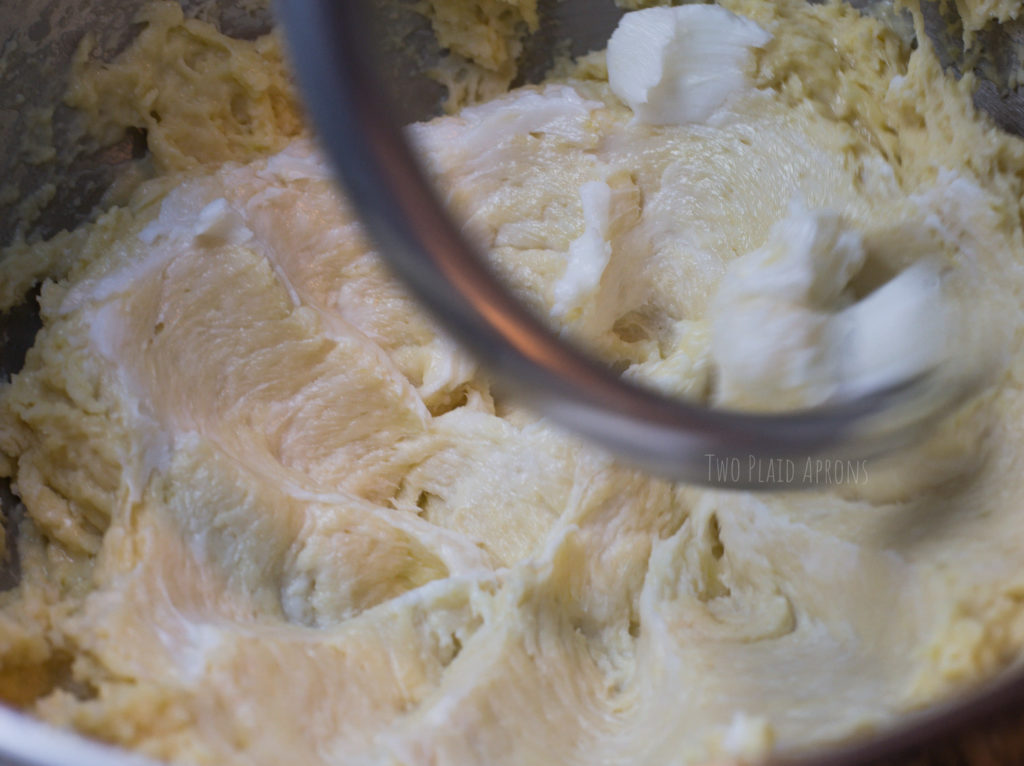 Blending shortening into the dough with a dough hook.