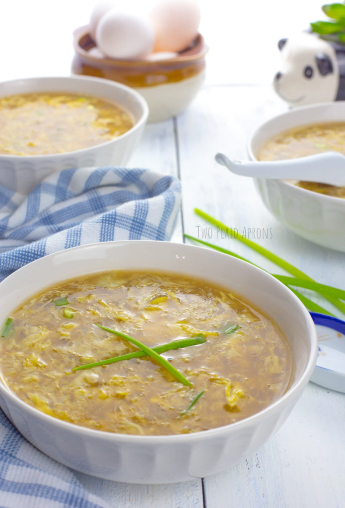 Bowls of egg drop soup with green onion.