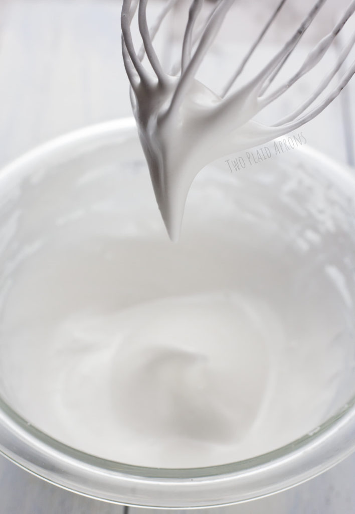 Whip aquafaba liquid and sugar until a thick peak forms.