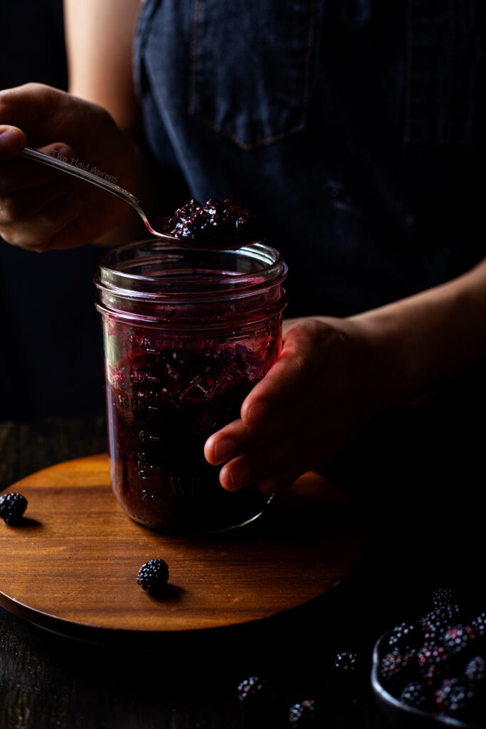 Scooping up a spoonful of our easy blackberry compote.