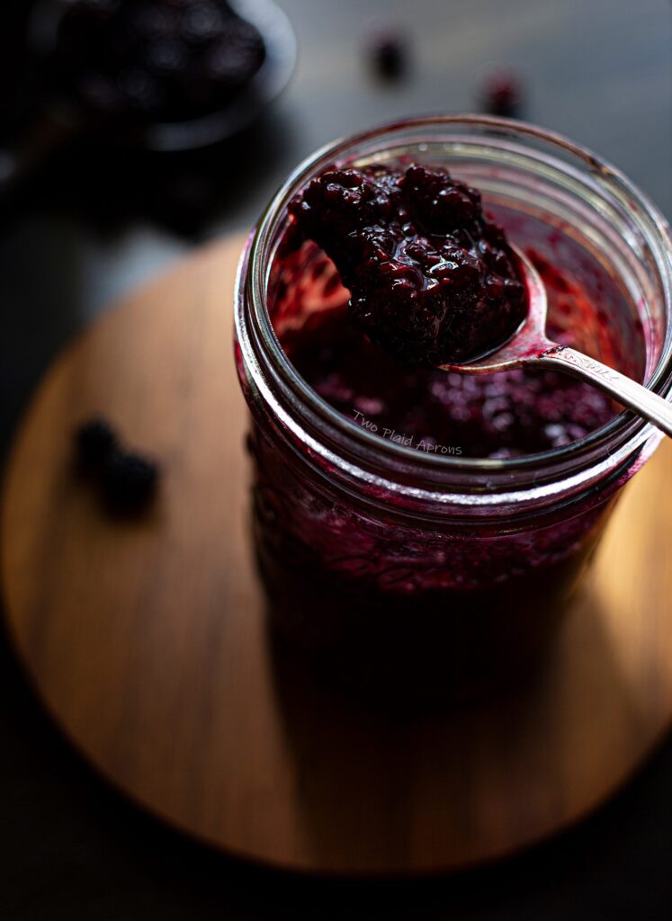 Top down shot of a spoonful of our easy blackberry compote.