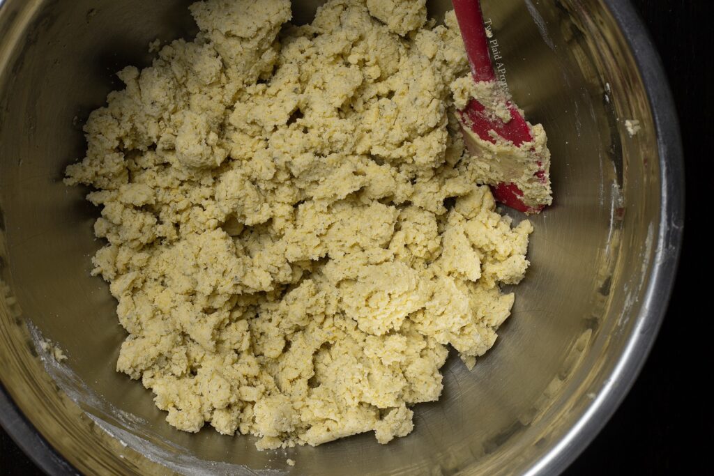 A bowl of shortbread cookie dough just finished mixing.
