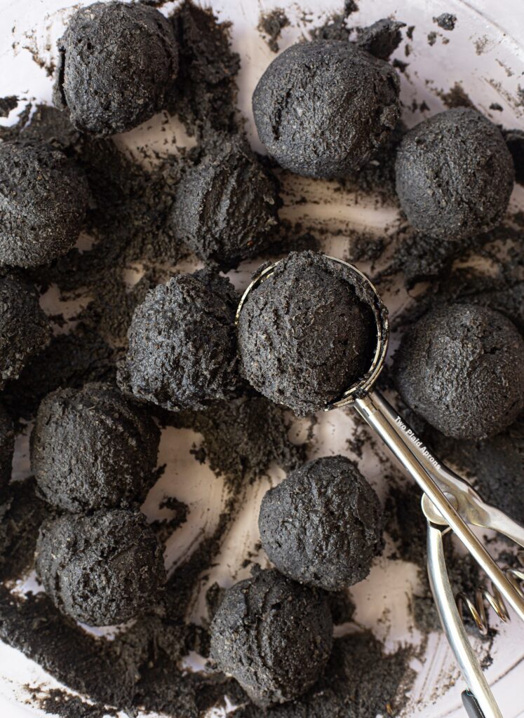 Black sesame filling portioned into balls with a cookie scoop.