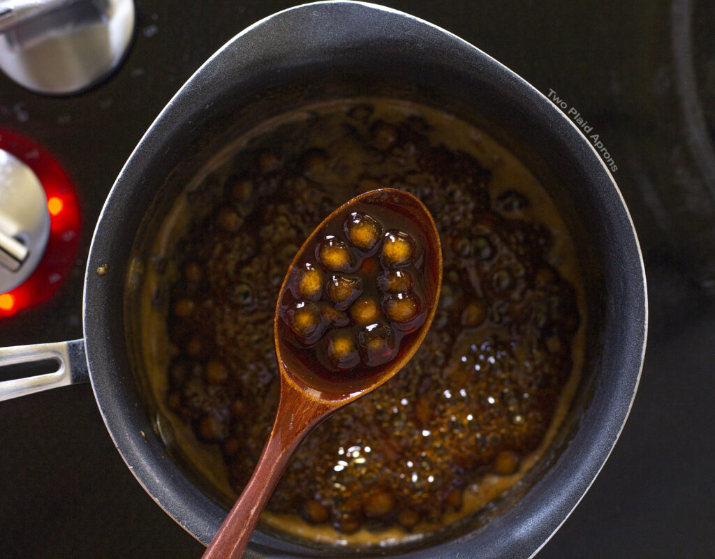 Brown sugar boba cooking in brown sugar syrup.