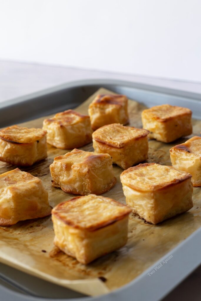 A pan of baked tofu on a sheet tray.