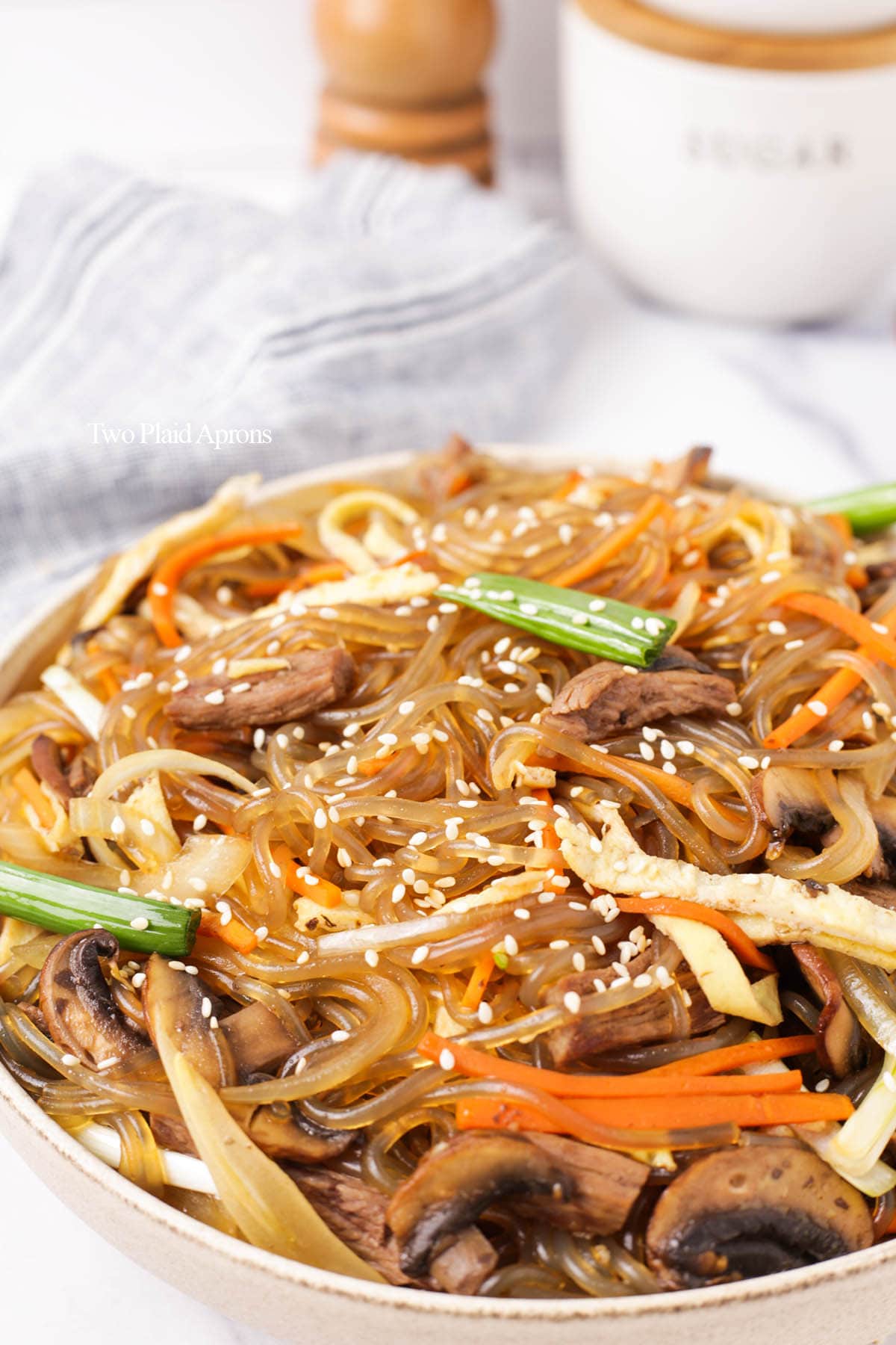 Front view of japchae with sesame seeds.