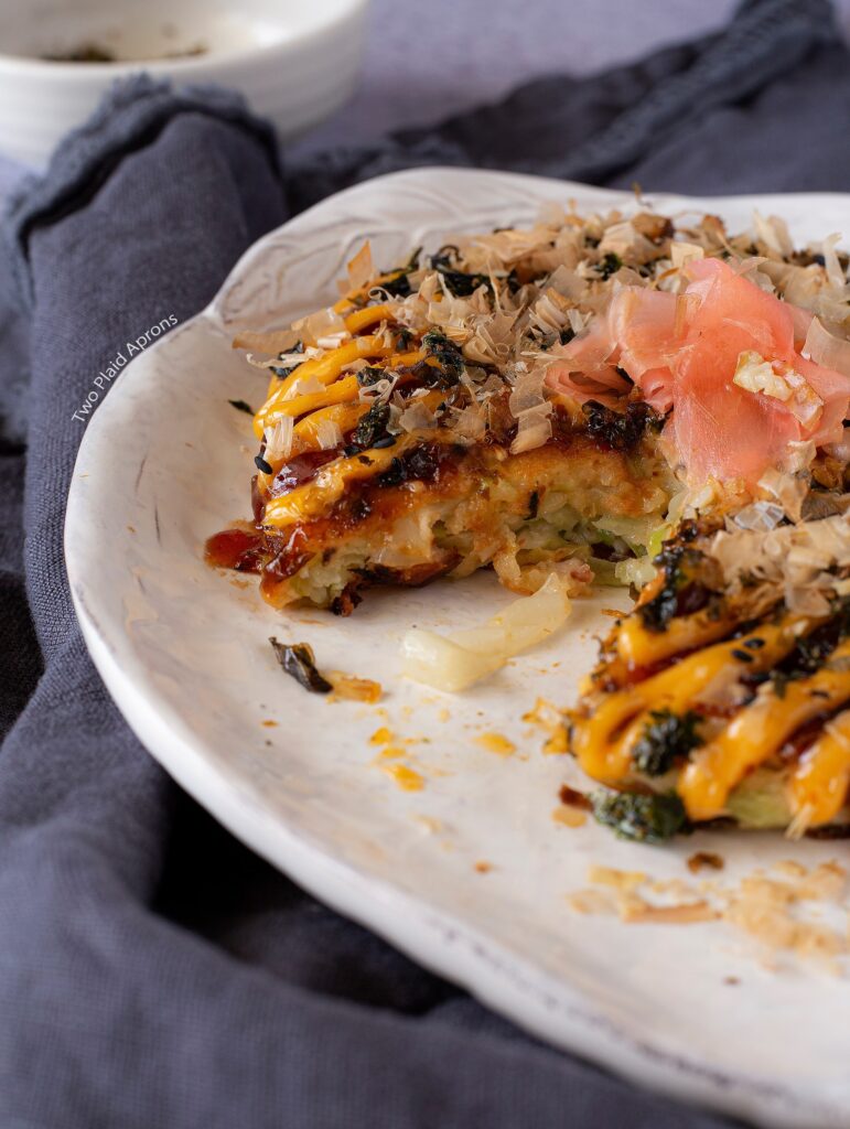 A wedge of Okonomiyaki pancake taken out.