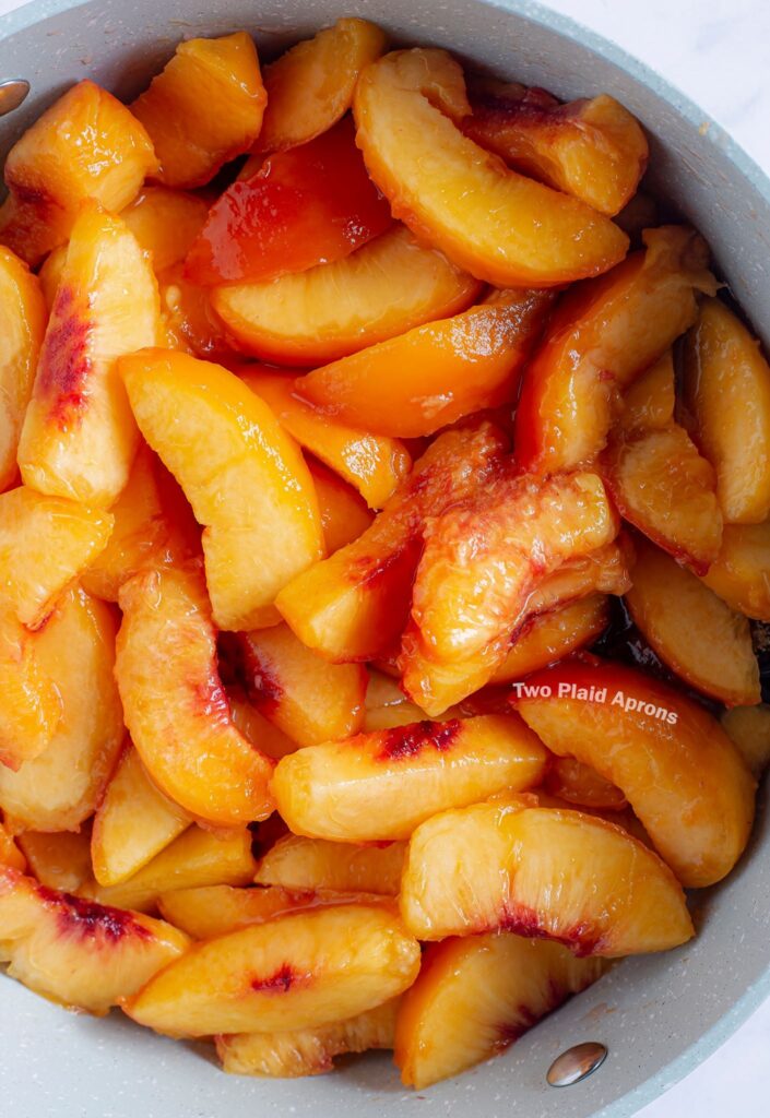 A pot of peach wedges ready for cobbler filling making.