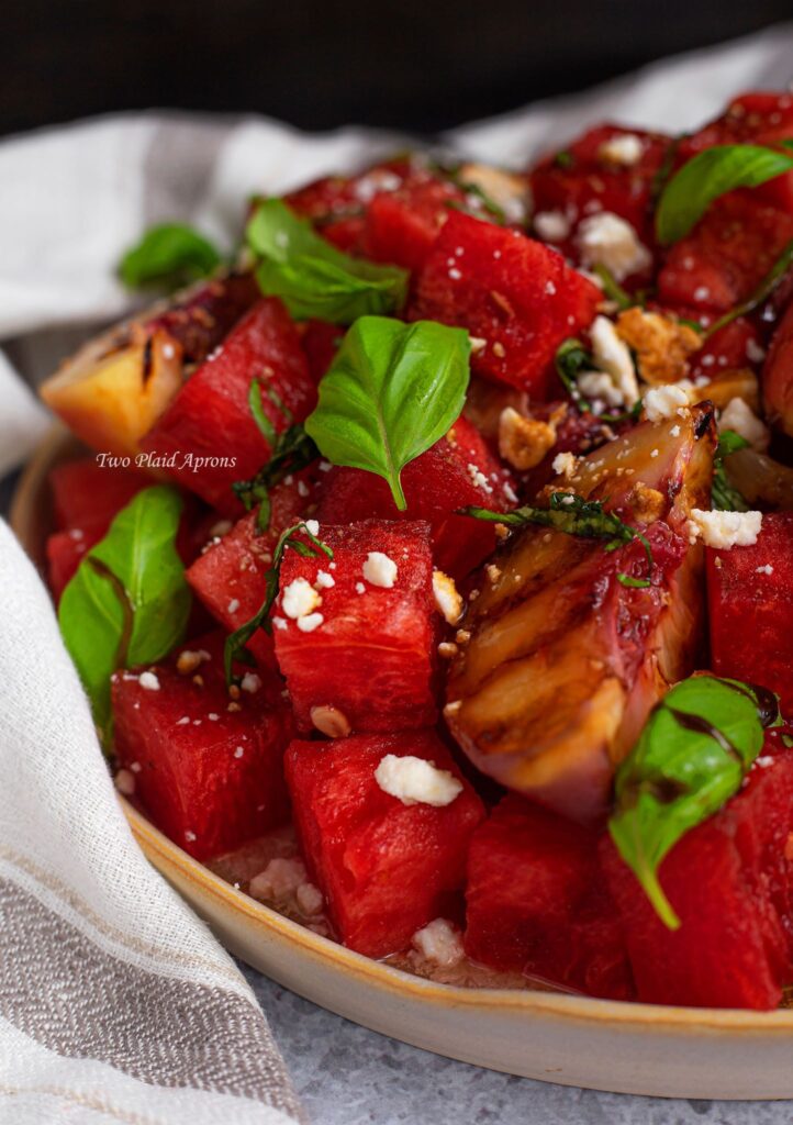 Close up side view of the watermelon and grilled peach salad.