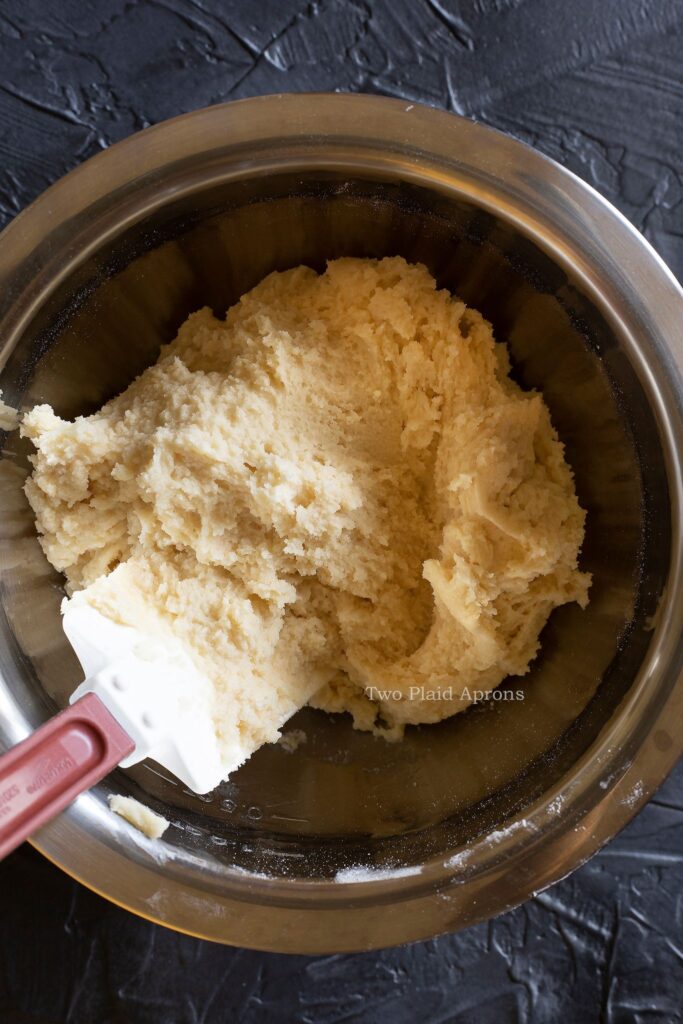 Showing the texture of the snickerdoodle cookie dough in a mixing bowl.