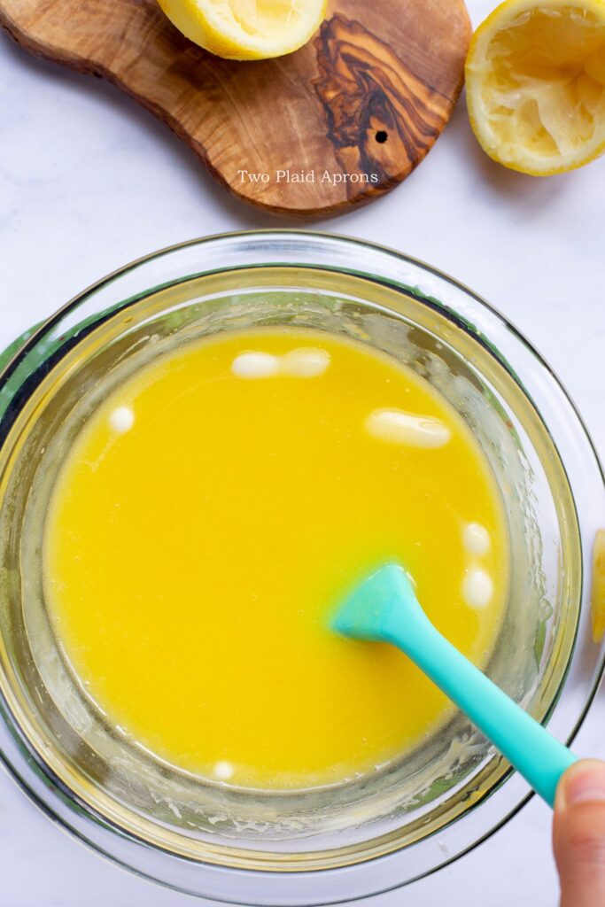 Mounting cold butter into hot lemon curd.