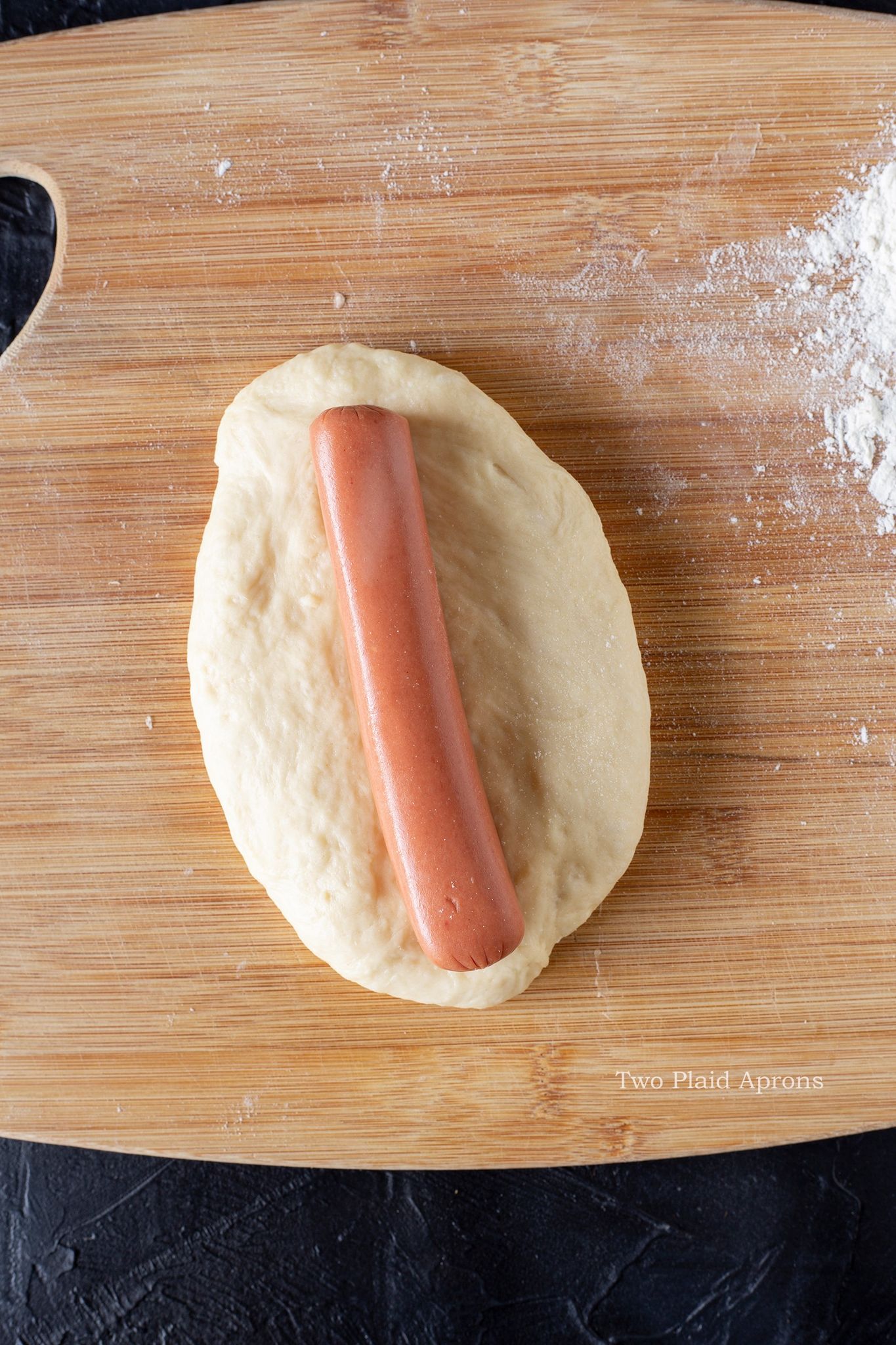 Sausage in the middle of the raw dough