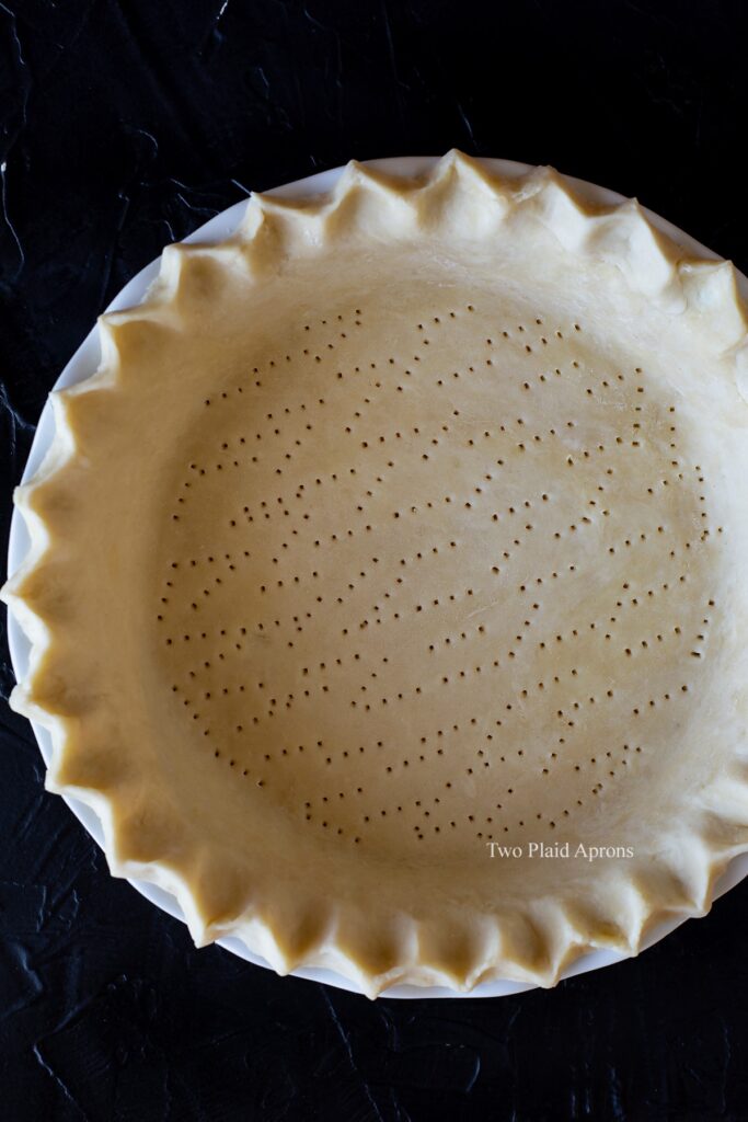 Top down view of pie crust before baking.