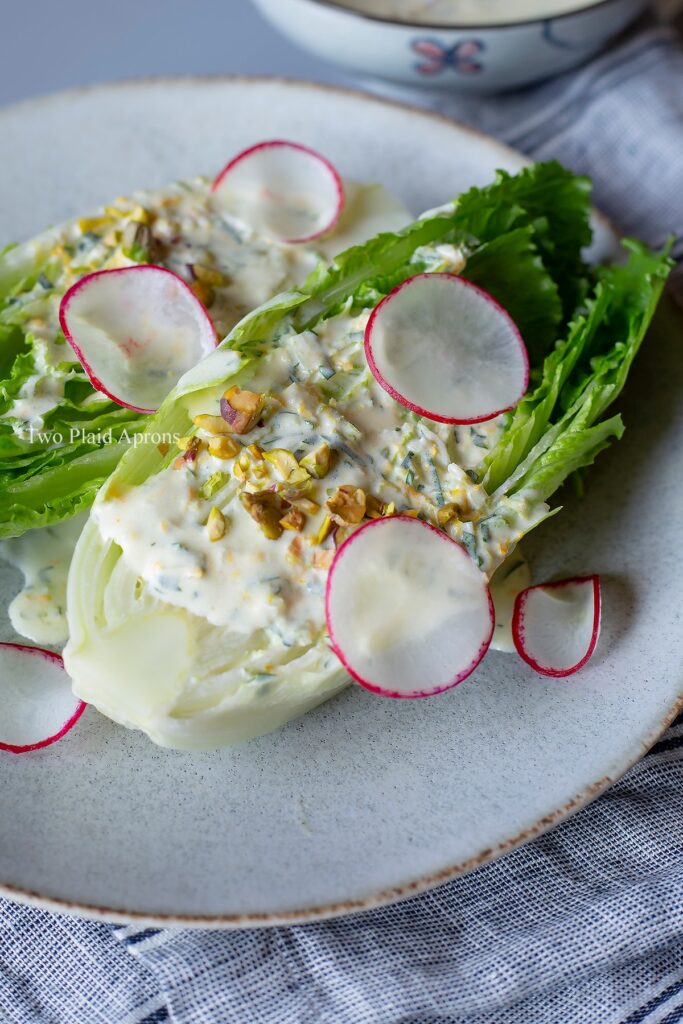 Close up, angled view of the creamy citrus vinaigrette salad on a plate.