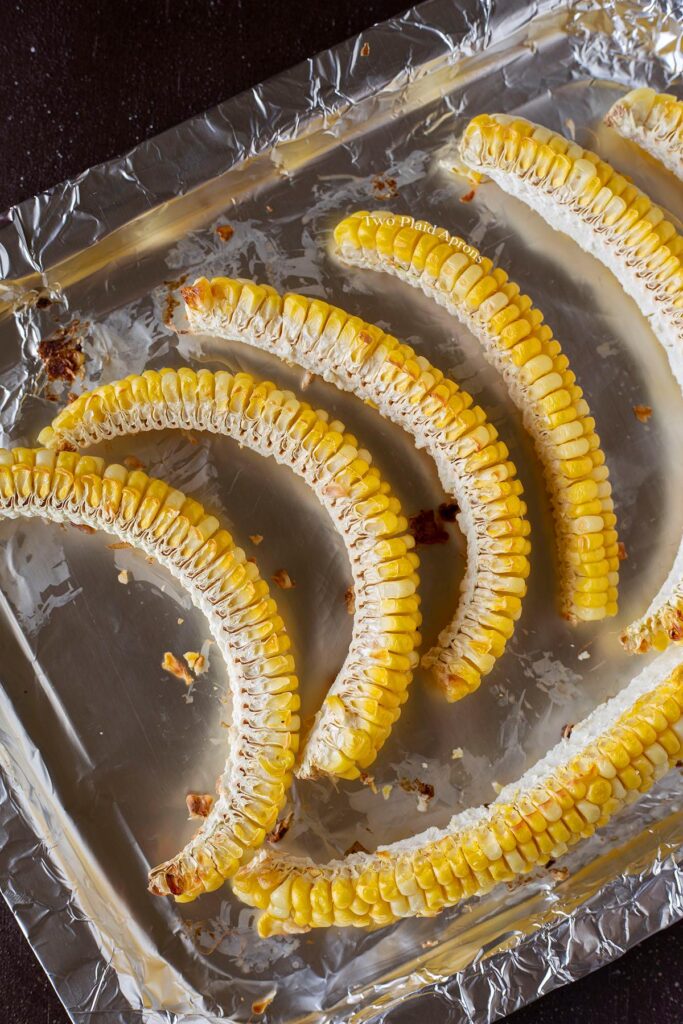 Quartered corn on the cob after baking.