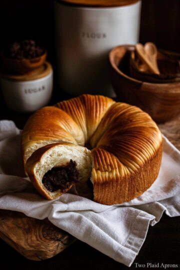 A piece of wool bread showing the red bean filling.