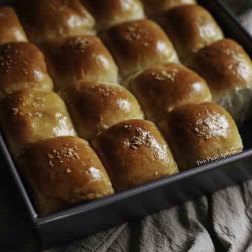 https://twoplaidaprons.com/wp-content/uploads/2021/12/milk-bread-rolls-thumbnail-500x500.jpg