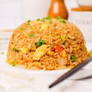 A mound of egg fried rice on a plate.