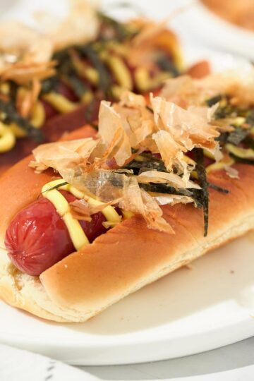 Angle view of Japadogs on a plate.