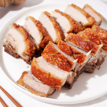 A plate of sliced crispy pork belly.