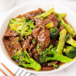 Beef and broccoli garnished with sesame seeds.
