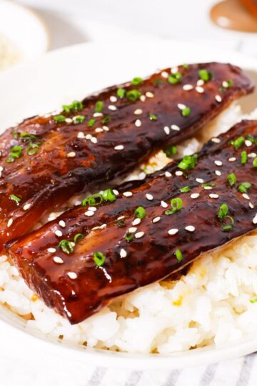 Eggplant unagi served over white rice.