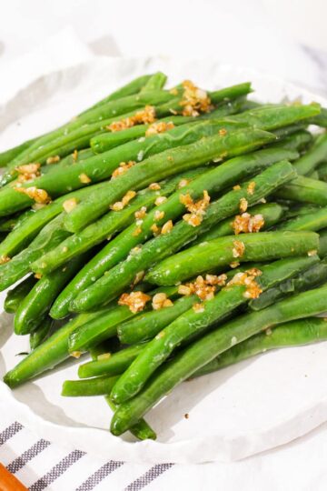 Din Tai Fung inspired Chinese garlic green beans on a plate.