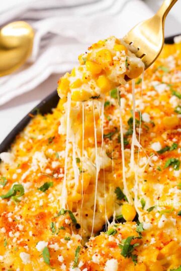 Taking a forkful of elote-style cheese corn.