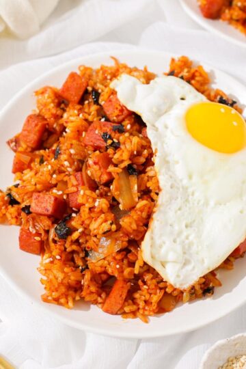 A plate of kimchi fried rice with spam.