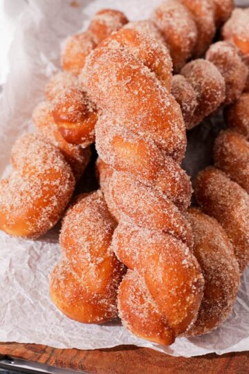 Korean twisted donuts on a parchment paper.