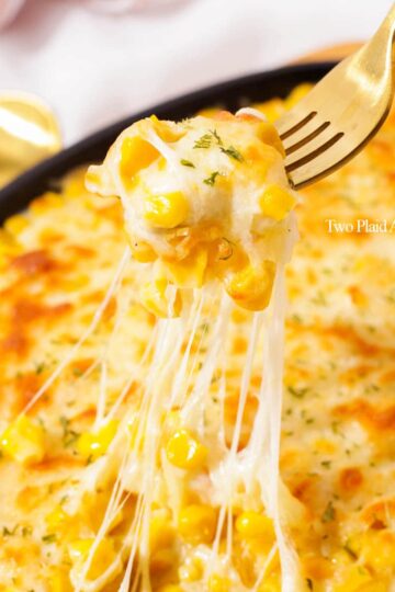 Picking up some Korean corn cheese with a fork.