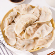 A plate of boiled pork and chive dumplings.
