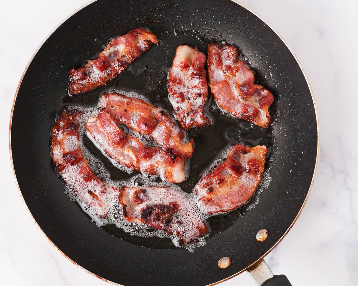 Cooking bacon in the pan.