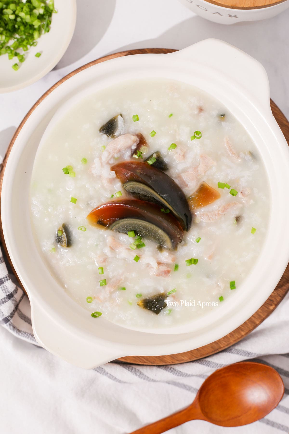 Top down of century egg and pork congee.