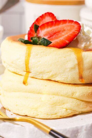 Close up of Japanese soufflé pancakes on a plate.