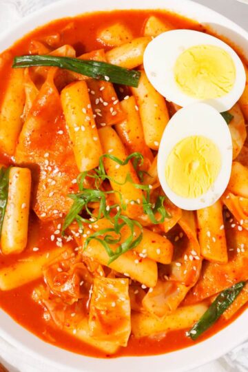 A plate tteokbokki with hard-boiled egg.