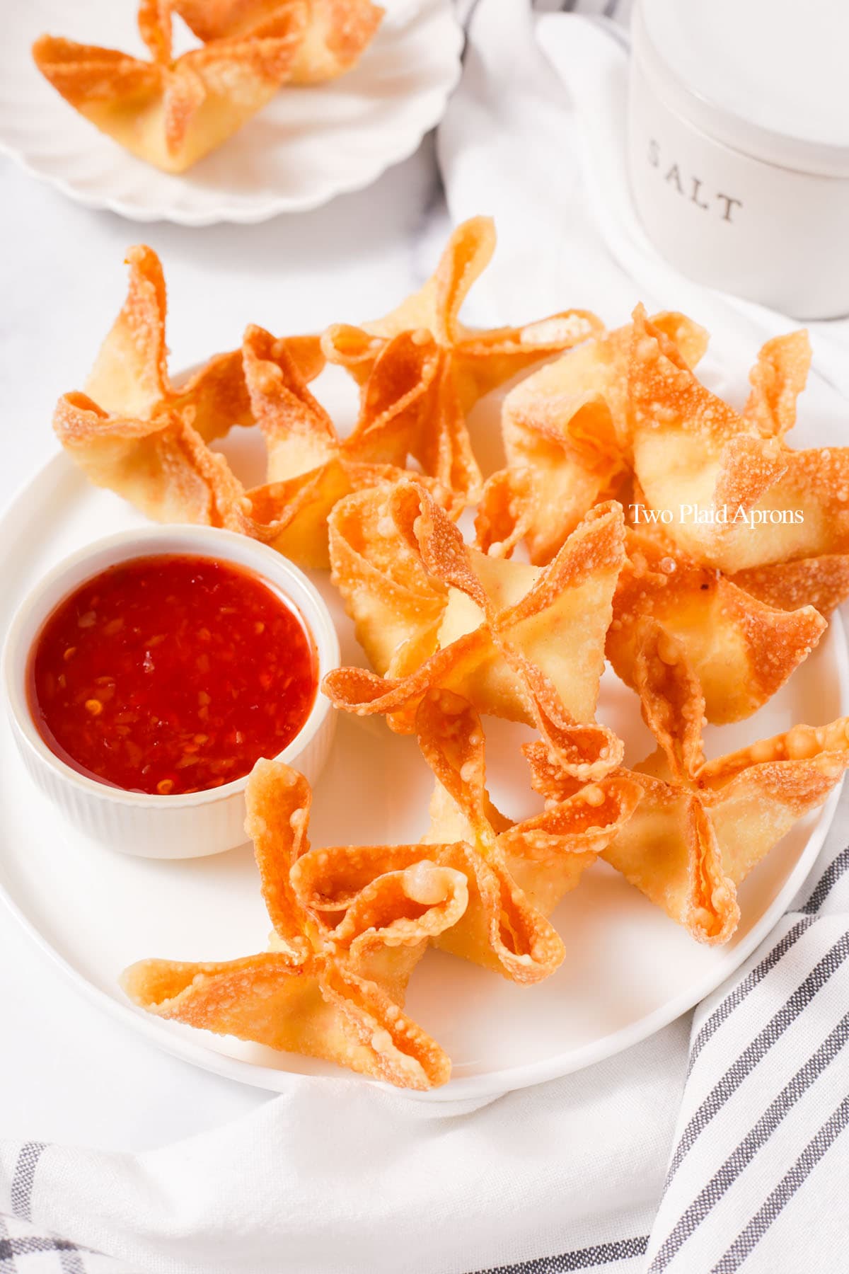 Crab wontons on a plate.