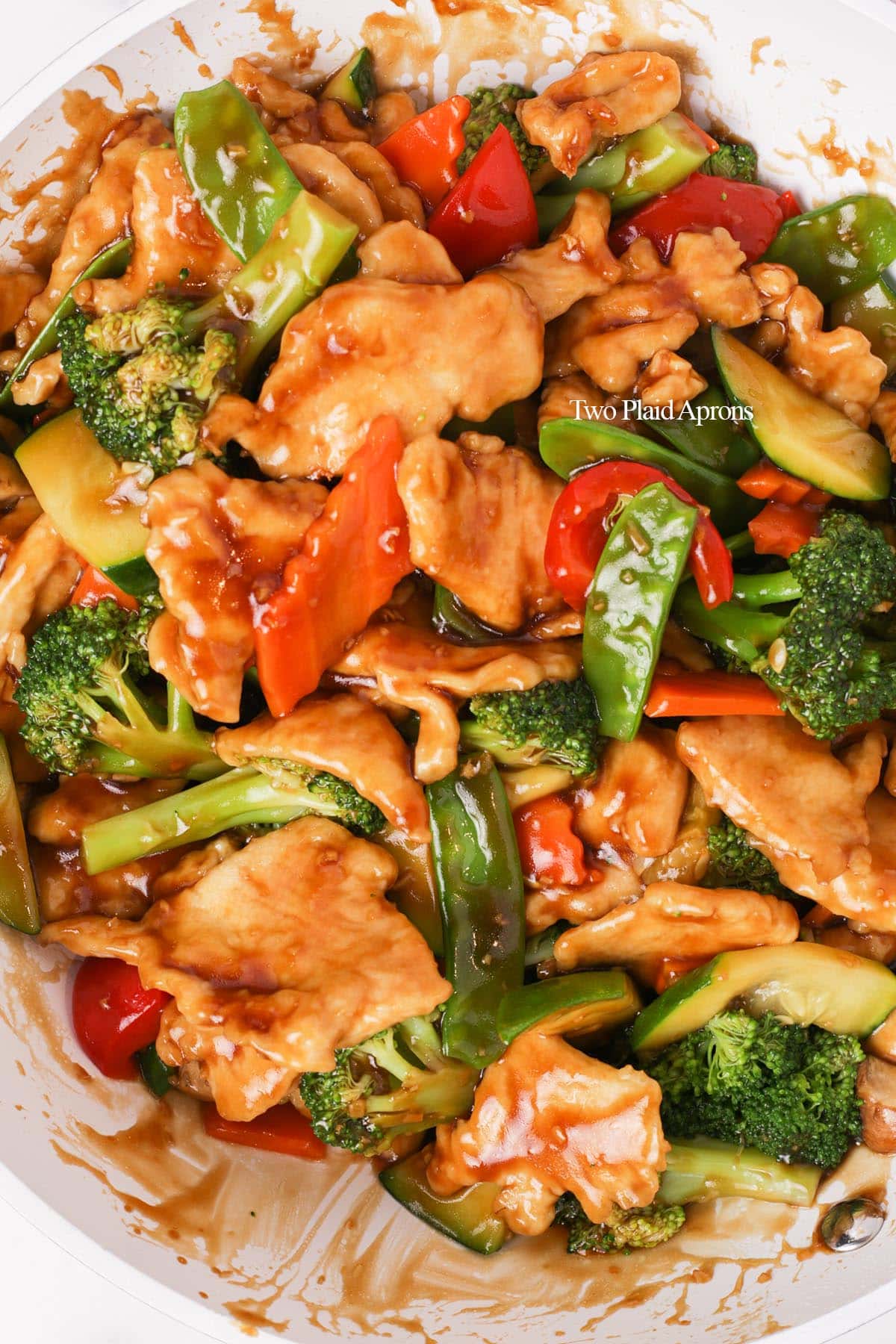 Pan with finishes chicken mixed vegetable stir fry.