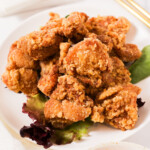 Karaage chicken on plate with dipping sauce thumbnail shot.