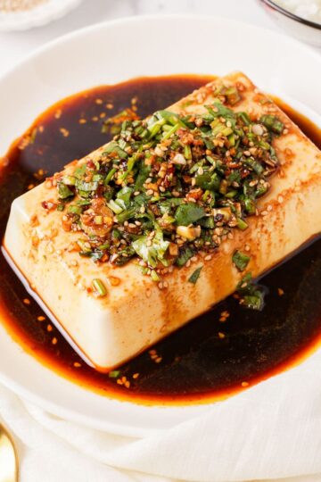 Side shot of the plate of cold tofu thumbnail shot.