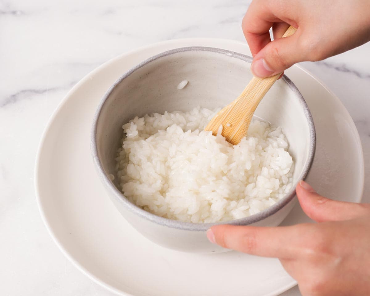Stirring in the rice and water together.