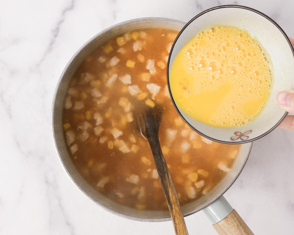 Pouring in the beaten eggs.