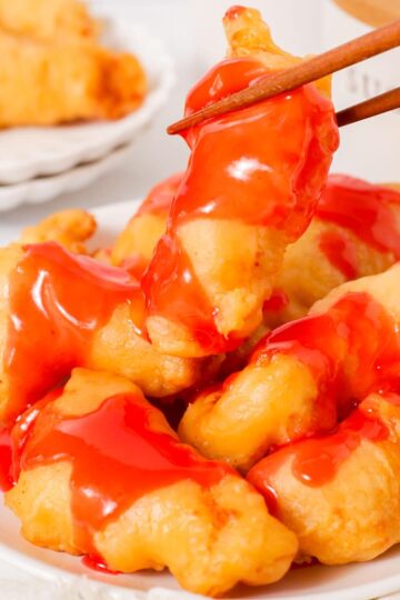 Sweet and sour chicken with glazed with sweet and sour sauce.