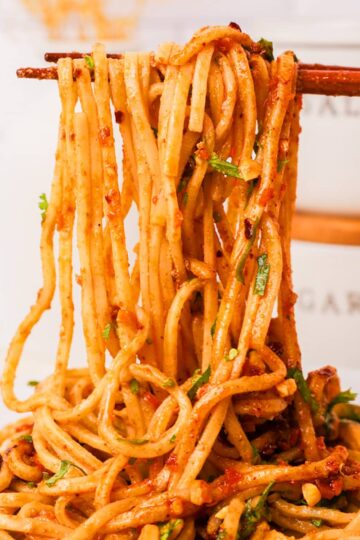 Chopsticks full of sesame noodles.