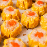 Steamed shumai garnished with roe.