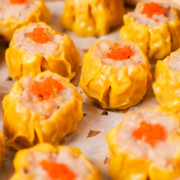 Steamed shumai garnished with roe.
