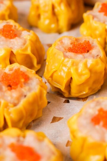 Steamed shumai garnished with roe.