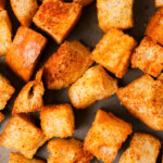 Close up of seasoned croutons.