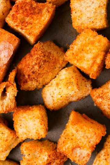 Close up of seasoned croutons.